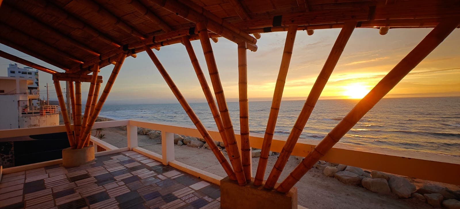 Sunset over the Pacific from the bamboo terrace at Hostal Cruzita